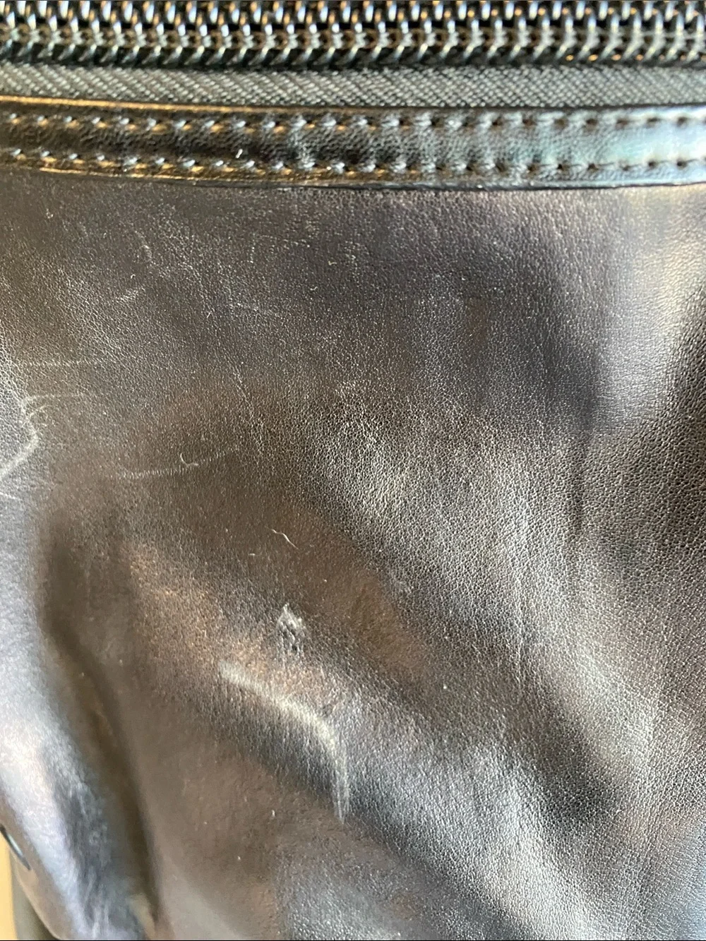 Tumi Black Leather Roll-Top Backpack with Front Pockets